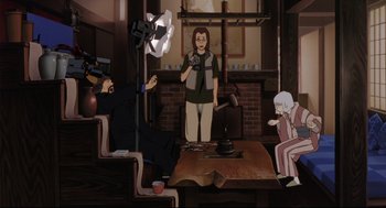 Movie still from “Millennium Actress” (2001), directed by Kô Matsuo – An animated scene of a woman holding a camera; Wide shot, High angle