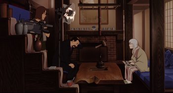 Movie still from “Millennium Actress” (2001), directed by Kô Matsuo – A man sitting in front of a table with a teapot on top of it; Wide shot, Over the shoulder angle