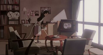 Movie still from “Millennium Actress” (2001), directed by Kô Matsuo – A woman is vacuuming in a living room; Wide shot, High angle