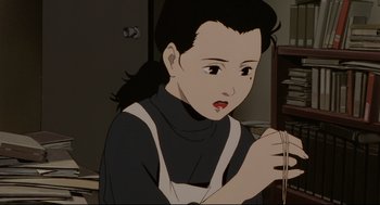 Movie still from “Millennium Actress” (2001), directed by Kô Matsuo – A woman is holding a string in her hand; Close Up shot, High angle