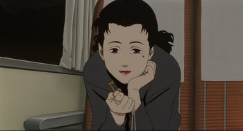 Movie still from “Millennium Actress” (2001), directed by Kô Matsuo – A woman holding a cell phone in front of a window; Close Up shot, High angle