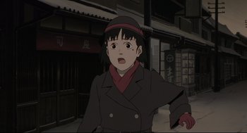 Movie still from “Millennium Actress” (2001), directed by Kô Matsuo – An animated woman in a black coat and red hat; Close Up shot, High angle