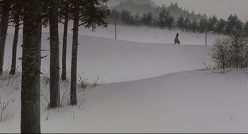 Movie still from “Millennium Actress” (2001), directed by Kô Matsuo – A person riding a snowboard down a snow covered slope; Extreme Wide shot, Low angle