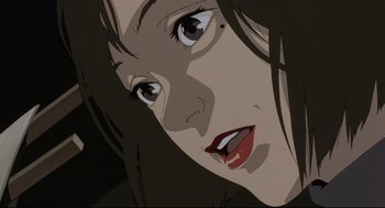 Movie still from “Millennium Actress” (2001), directed by Kô Matsuo – A woman's face in a black and white image; Extreme Close Up shot, Low angle