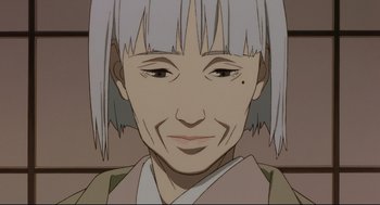 Movie still from “Millennium Actress” (2001), directed by Kô Matsuo – An older woman with white hair is smiling for the camera; Close Up shot, Low angle