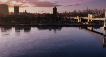 Movie still from “Mimic” (1997), directed by Guillermo del Toro – A view of a city skyline at sunset; Extreme Wide shot, High angle