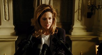 Movie still from “Mimic” (1997), directed by Guillermo del Toro – A woman is standing in front of microphones; Close Up shot, High angle