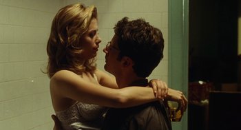 Movie still from “Mimic” (1997), directed by Guillermo del Toro – A man and a woman are hugging in a bathroom; Close Up shot, Low angle
