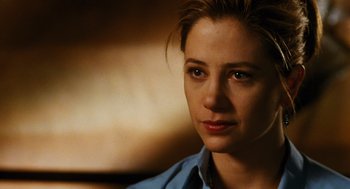 Movie still from “Mimic” (1997), directed by Guillermo del Toro – A person wearing a blue shirt; Close Up shot, Over the shoulder angle