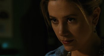 Movie still from “Mimic” (1997), directed by Guillermo del Toro – A woman's face in the dark; Close Up shot, Over the shoulder angle