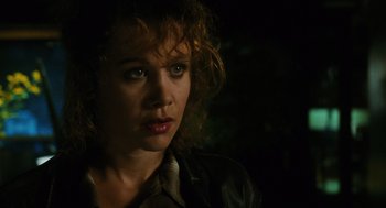 Movie still from “Mimic” (1997), directed by Guillermo del Toro – A person with curly hair; Close Up shot, Over the shoulder angle