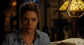 Movie still from “Mimic” (1997), directed by Guillermo del Toro – A person wearing a necklace; Close Up shot, Over the shoulder angle