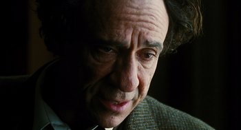 Movie still from “Mimic” (1997), directed by Guillermo del Toro – An older man is looking at the camera; Close Up shot, Low angle