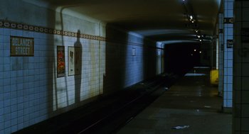 Movie still from “Mimic” (1997), directed by Guillermo del Toro – A train track in the middle of a subway tunnel; Extreme Wide shot, High angle