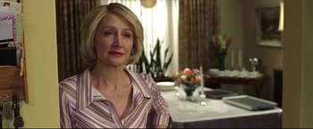 Movie still from “Miracle” (2004), directed by Gavin O'Connor – A person sitting at a table; Close Up shot, Over the shoulder angle