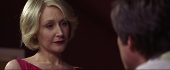 Movie still from “Miracle” (2004), directed by Gavin O'Connor – An older woman looking at a younger man in front of a wall; Close Up shot, Over the shoulder angle