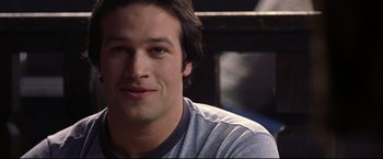 Movie still from “Miracle” (2004), directed by Gavin O'Connor – A person wearing a shirt; Close Up shot, Over the shoulder angle