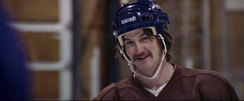 Movie still from “Miracle” (2004), directed by Gavin O'Connor – A person wearing a hockey helmet; Close Up shot, High angle