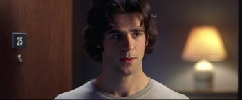 Movie still from “Miracle” (2004), directed by Gavin O'Connor – A person with long brown hair; Close Up shot, Over the shoulder angle