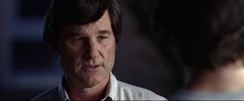Movie still from “Miracle” (2004), directed by Gavin O'Connor – A person wearing a white shirt; Close Up shot, Over the shoulder angle