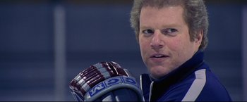 Movie still from “Miracle” (2004), directed by Gavin O'Connor – A man with a hockey glove; Close Up shot, Low angle