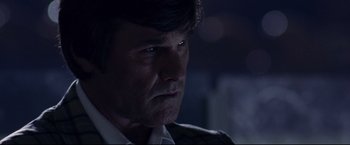 Movie still from “Miracle” (2004), directed by Gavin O'Connor – A person wearing a suit and tie; Close Up shot, Low angle