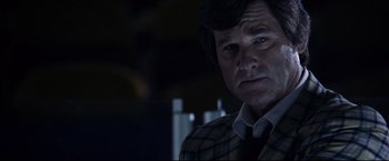 Movie still from “Miracle” (2004), directed by Gavin O'Connor – A person wearing a suit and tie; Close Up shot, Over the shoulder angle