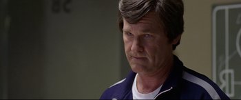 Movie still from “Miracle” (2004), directed by Gavin O'Connor – An older man is looking at the camera; Close Up shot, Over the shoulder angle