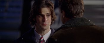 Movie still from “Miracle” (2004), directed by Gavin O'Connor – A man wearing a suit and tie talking to another man wearing a suit and tie; Close Up shot, Over the shoulder angle