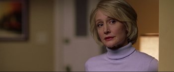 Movie still from “Miracle” (2004), directed by Gavin O'Connor – A person with short hair wearing a sweater; Close Up shot, Over the shoulder angle