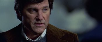 Movie still from “Miracle” (2004), directed by Gavin O'Connor – A person wearing a suit and tie; Close Up shot, Over the shoulder angle