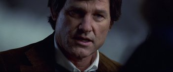 Movie still from “Miracle” (2004), directed by Gavin O'Connor – A person wearing a suit and tie; Close Up shot, Over the shoulder angle