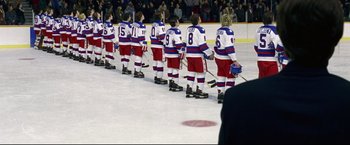 Movie still from “Miracle” (2004), directed by Gavin O'Connor – A group of hockey players lined up on the ice; Wide shot, High angle