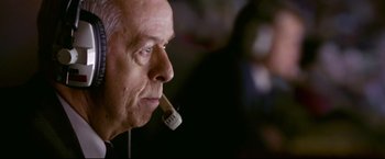 Movie still from “Miracle” (2004), directed by Gavin O'Connor – An older man with a wooden spoon in his mouth; Close Up shot, Low angle
