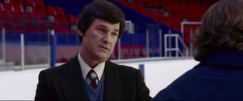 Movie still from “Miracle” (2004), directed by Gavin O'Connor – A person wearing a suit and tie; Close Up shot, Over the shoulder angle