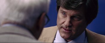 Movie still from “Miracle” (2004), directed by Gavin O'Connor – A person wearing a suit and tie; Close Up shot, Over the shoulder angle
