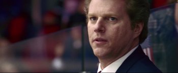 Movie still from “Miracle” (2004), directed by Gavin O'Connor – A person wearing a suit and tie; Close Up shot, Low angle