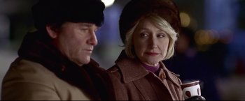 Movie still from “Miracle” (2004), directed by Gavin O'Connor – A man and a woman wearing hats and coats; Close Up shot, Over the shoulder angle