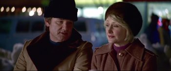 Movie still from “Miracle” (2004), directed by Gavin O'Connor – A man and a woman sitting next to each other; Close Up shot, Over the shoulder angle