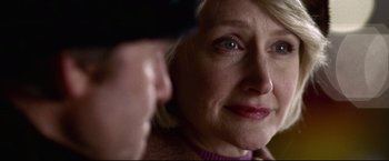 Movie still from “Miracle” (2004), directed by Gavin O'Connor – An older woman is looking into the camera; Close Up shot, Over the shoulder angle