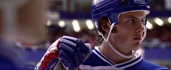 Movie still from “Miracle” (2004), directed by Gavin O'Connor – A hockey player holding a hockey stick; Close Up shot, Low angle
