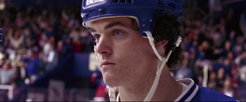 Movie still from “Miracle” (2004), directed by Gavin O'Connor – A person wearing a hockey helmet; Close Up shot, Low angle