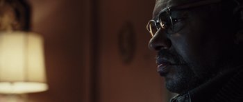 Movie still from “Miracle at St. Anna” (2008), directed by Spike Lee – A person wearing glasses; Close Up shot, Low angle