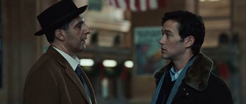 Movie still from “Miracle at St. Anna” (2008), directed by Spike Lee – Two men in suits and hats talking to each other; Close Up shot, Over the shoulder angle