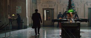 Movie still from “Miracle at St. Anna” (2008), directed by Spike Lee – A man in a top hat walking down a hall way; Wide shot, Low angle