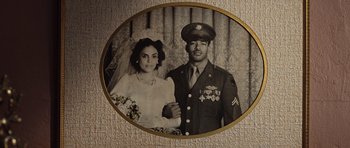 Movie still from “Miracle at St. Anna” (2008), directed by Spike Lee – An old photo of a man and a woman; Extreme Close Up shot, Overhead angle