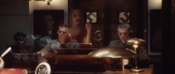 Movie still from “Miracle at St. Anna” (2008), directed by Spike Lee – A group of people sitting at a table; Medium shot, Over the shoulder angle