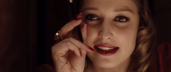 Movie still from “Miracle at St. Anna” (2008), directed by Spike Lee – A person holding a cell phone up to their face; Extreme Close Up shot, Overhead angle