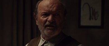 Movie still from “Miracle at St. Anna” (2008), directed by Spike Lee – An old man with a beard and a mustache; Close Up shot, Over the shoulder angle