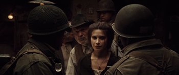 Movie still from “Miracle at St. Anna” (2008), directed by Spike Lee – A group of people standing next to each other; Medium shot, Over the shoulder angle